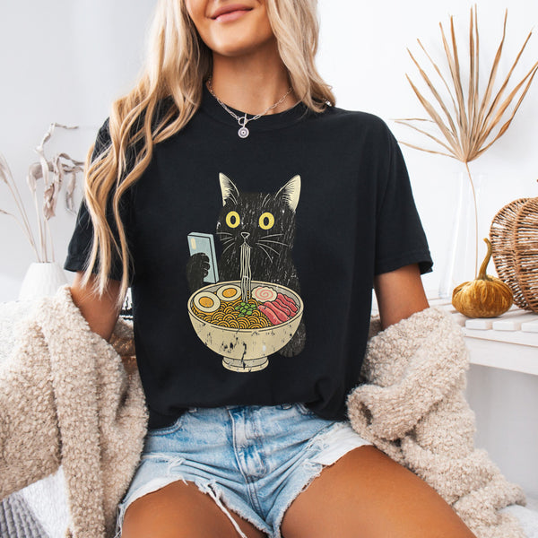Ramen Cat — Cute Black Cat Holding Bowl of Ramen Graphic Tee shown on a model