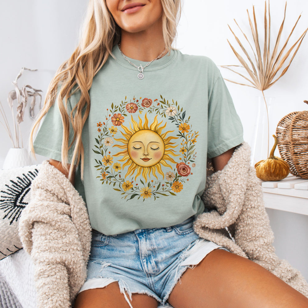 Woman wearing a Bay Comfort Colors 1717 tee with a vintage sun and floral graphic
