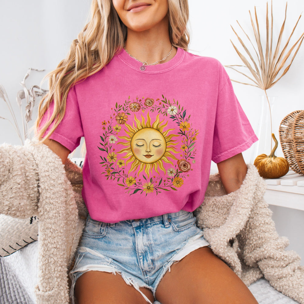 Woman wearing a Crunchberry Comfort Colors 1717 tee with a vintage sun and floral graphic
