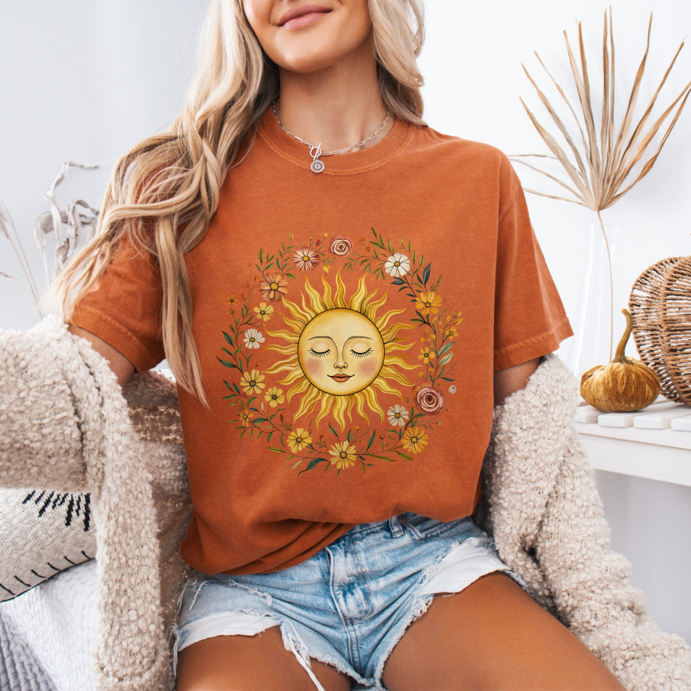 Woman wearing a Yam Comfort Colors 1717 tee with a vintage sun and floral graphic