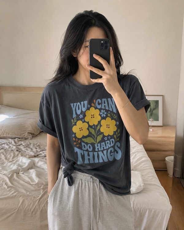 The Garden Reminder Tee shown on a model